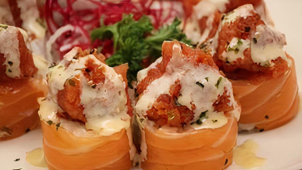 Volcano · California Roll salmon and spicy tuna baked with sesame sauce