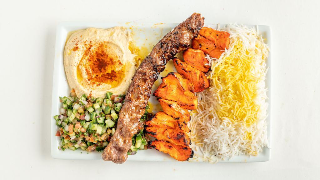 Chicken Sultani · 1 skewer ground beef, 1 skewer chicken kabab, rice, hummus, and Shirazi salad.