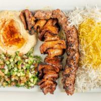 Beef Sultani · 1 skewer ground beef, 1 skewer beef kabab, rice, hummus, and Shirazi salad.
