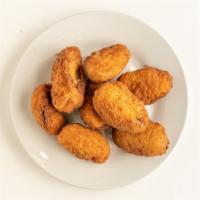 Jalapeño Poppers · Juicy jalapeño poppers breaded & filled with cheese & fried to golden perfection.