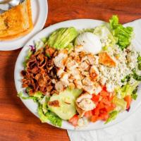 Cobb Salad · grilled chicken, iceberg lettuce, blue cheese crumbles, applewood bacon, avocado, tomato, eg...