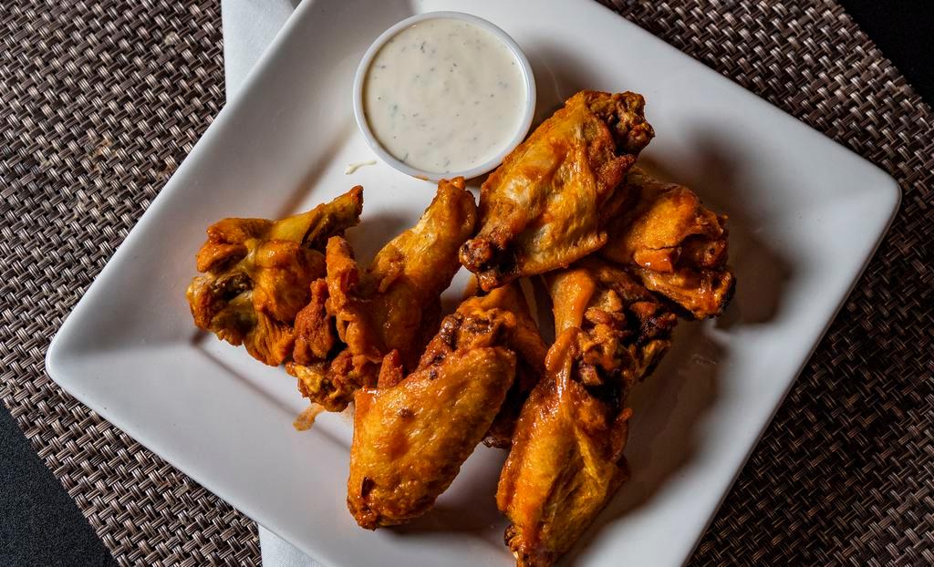 Wings (8) · Buffalo, honey sriracha, garlic parmesan or BBQ wings served with a side of bleu cheese or ranch dressing.