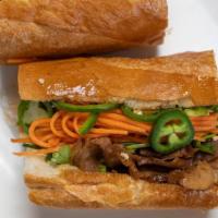 Berkshire Pork Banh Mi · Pork shoulder, pork belly, cucumbers, cilantro, craft pickles, and mayonnaise.