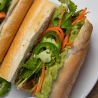 Vegetarian Banh Mi · Crispy tofu, avocado mash, cucumbers, cilantro, craft pickles, and mayonnaise.