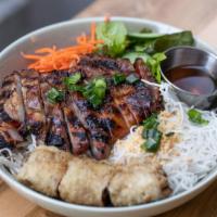 Natural Pork Vermicelli Salad · Grilled natural pork served over cold vermicelli noodles and roasted peanuts with cucumber m...