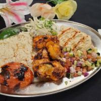 Take My Heart Chicken Breast Plate · Tender pieces of seasoned chicken over rice. Served with our cucumber and tomato salad, leaf...
