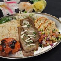 Greek Gyro Plate Love Story Plate · A classic greek dish! This gyro love story includes greek gyro over rice served with our cuc...