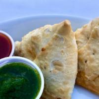 Samosas · Two Savory Pastries filled With Potatoes and Peas. Vegan