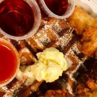 Chicken Wings (4Pcs) On A Large Belgium Waffle! · Chicken Wings (4pcs) on a Large Waffle served with Syrup, Butter and Hot Sauce