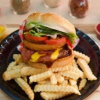 Western Burger · All the goodness of the classic burger with onion rings topped with two classic cut bacon an...