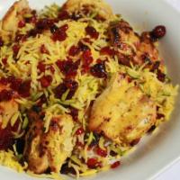 Chicken Koobideh · Two skewers of seasoned ground chicken on saffron basmati rice.
