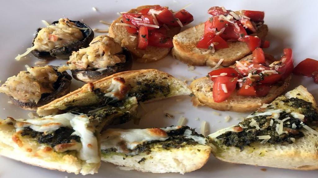 Bruschetta · Roma tomatoes with fresh Parmesan served with seasoned baguette.