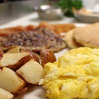 Breakfast Platter · Two Pancakes, two eggs any style, fried red potatoes, two sausages or two bacon strips.