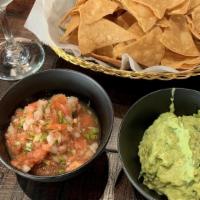 Chips Salsa & Guacamole · Homemade corn tortilla chips freshly made served with pico de gallo salsa and fresh made gua...