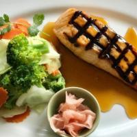 Grilled Ginger Salmon · Grilled 8oz fillet of fresh norwegian salmon topped with our savory teriyaki sauce, served w...