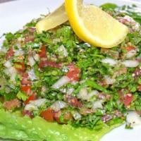 Tabbouleh Salad · Fresh parsley, chopped onion, bulgur, tomato salad