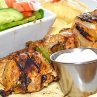 Chicken Kabab Platter · Grilled chicken breast kebab style, chopped tomatoes, pickles and garlic sauce