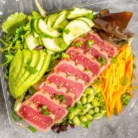 Seared Tuna Poke Salad · Perfectly seared tuna served on a bed of delectable greens with delicious edamame, refreshin...