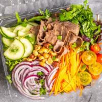 Thai Beef Salad · Spring-mix salad, tomato, onion, carrots, cucumber, cilantro, green onion, beef, and PEANUTS.