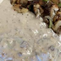 Okie Special · Scramble eggs, onion, bell pepper, and sausage over two biscuits top with gravy. With countr...