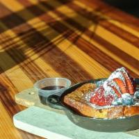 Brioche French Toast · Brioche French Toast topped with Fresh Berries, Dusted with Powdered Sugar, and a side of Ma...