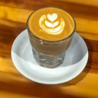Cortado · Local favorite. Double shot espresso with equal part of milk of your choice. Hot 5 Oz pour o...