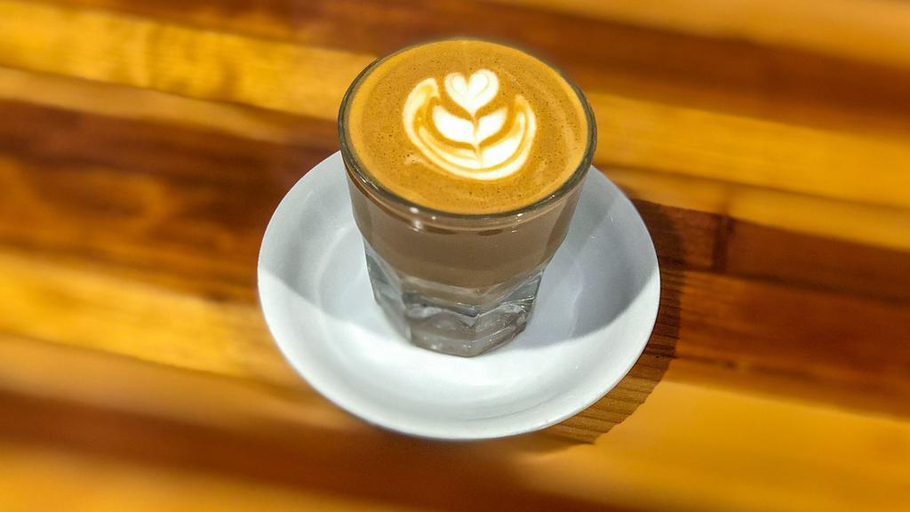 Cortado · Local favorite. Double shot espresso with equal part of milk of your choice. Hot 5 Oz pour only.