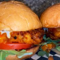 Buffalo Soldier · Two sliders and fries.
Fried chicken breasts tossed in buffalo sauce, arugula, tomato and to...