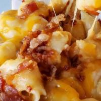 Crab Mac N Cheese · Our homemade mac n cheese baked with king crab lump meat and topped with crispy bacon.