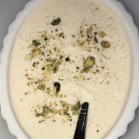 Kheer · Delicious rice pudding garnished with nuts.