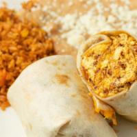 Breakfast Burrito · Bacon and chorizo with eggs, salsa fresca and cheddar cheese rolled in a flour tortilla. Can...