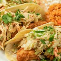 Tacos Del Mar (Fish Tacos) · Three corn tortillas filled with fried alaskan cod, signature chipotle coleslaw and cilantro.