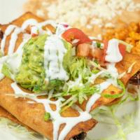 Taquitos · Crispy corn tortilla rolled with braised chicken breast or beef brisket topped with queso fr...