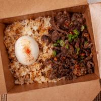 Tapa Silog · Thin cut ribeye steak marinated in garlic and lime. Served with garlic rice and soft boiled ...