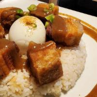 Lechon Kawali Silog · Super tender twiced cooked pork belly.  Served with garlic rice and soft boiled egg.