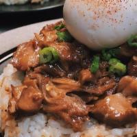 Adobo Chicken Silog · Chicken braised in garlic, soy, vinegar, and spices. Served with garlic rice and soft boiled...