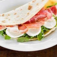 Piadina Caprese · Sliced tomatoes, fresh mozzarella cheese, basil