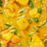 Yellow Curry · Yellow curry paste with coconut milk, potato, onion, and carrots.