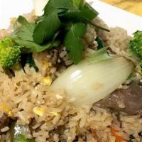 Thai Fried Rice · Wok-fried rice with egg, onions, carrots, tomato and broccoli.