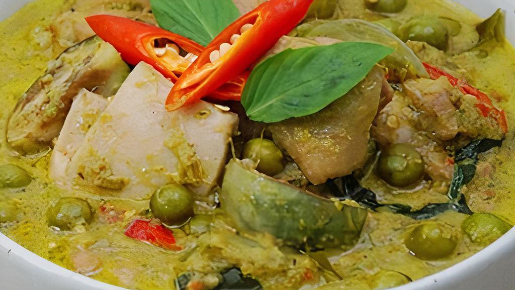 Green Curry · Green curry paste with coconut milk, green beans, eggplant, bamboo, red bell pepper,
and basil.