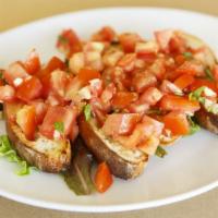 Bruschetta Al Pomodoro · Homemade bread topped with fresh tomatoes, garlic, basil, and extra virgin olive oil. Add Bu...