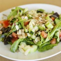 Insalata Della Casa · Organic spring mix, cucumber, tomatoes, and roasted almonds, tossed with gorgonzola vinaigre...