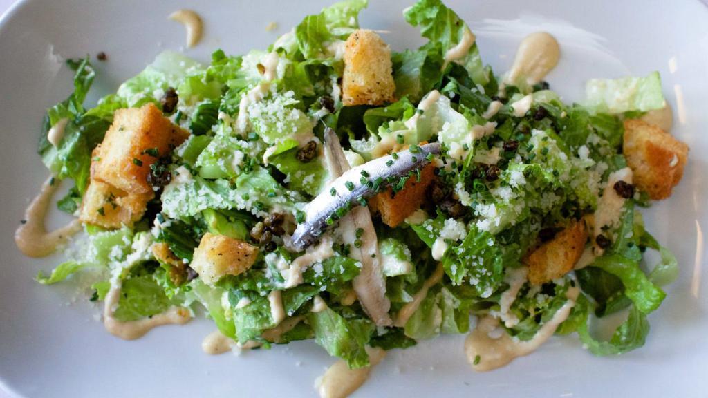 Caesar Salad · romaine hearts, garlic croutons, white anchovies, 
crispy capers, pecorino, Tijuana vinaigrette