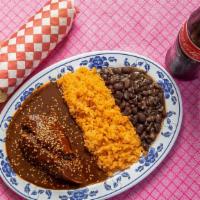 Mole Poblano · Includes chicken breast, rice, black beans, and three handmade tortillas. Topped with our in...