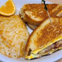 Bacon Egg And Cheese Melt · Buttered Sourdough bread with melted American cheese , 3 scrambled eggs, and 3 pieces of bac...
