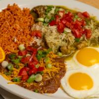 Chile Verde Breakfast Platter · Tender pork stewed with tomatillos and fresh salsa, 2 eggs, served with beans, rice and warm...
