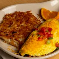 Ham N Cheese Omelet · Stuffed with diced ham and cheddar cheese. Your choice of potatoes and either toast or biscu...