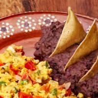 Huevos A La Mexicana · Two scrambled eggs mix with onions, tomatoes and bell peppers.W/ Rice & Beans & Tortillas.