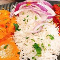 Delicious Lunch Special · Served with rice, naan, choice of two curries, soup.