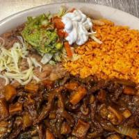 Carne Asada (Steak) · Includes rice beans guacamole and tortillas.